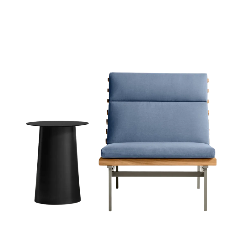 The Perch Outdoor Lounge Chair from Blu Dot with carbon frame and sunbrella haze upholstery with a circula side table.