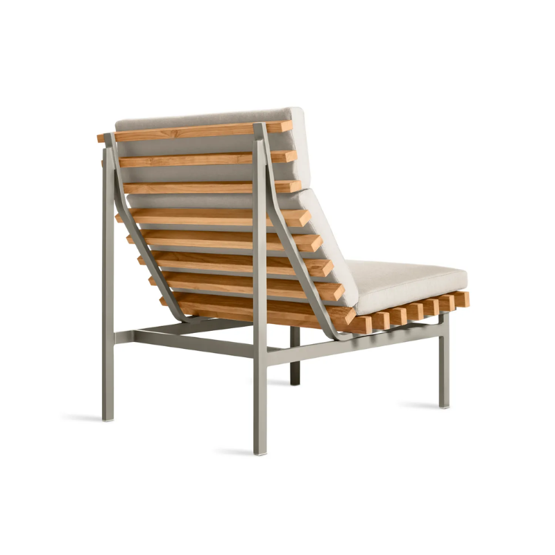 The Perch Outdoor Lounge Chair from Blu Dot with carbon frame and sunbrella linen upholstery from the back at an angle.