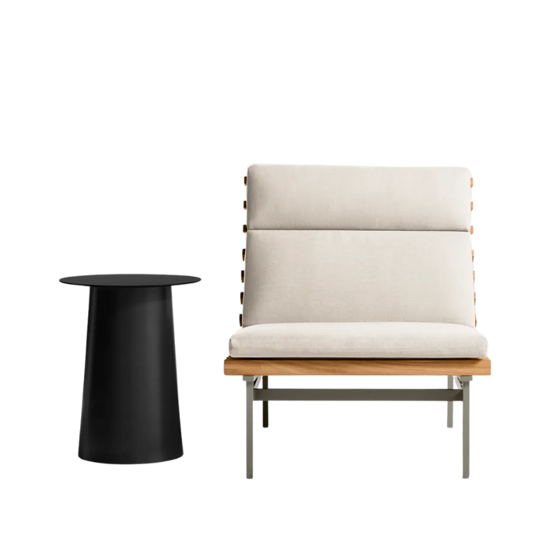 The Perch Outdoor Lounge Chair from Blu Dot with carbon frame and sunbrella linen upholstery with a circula side table.