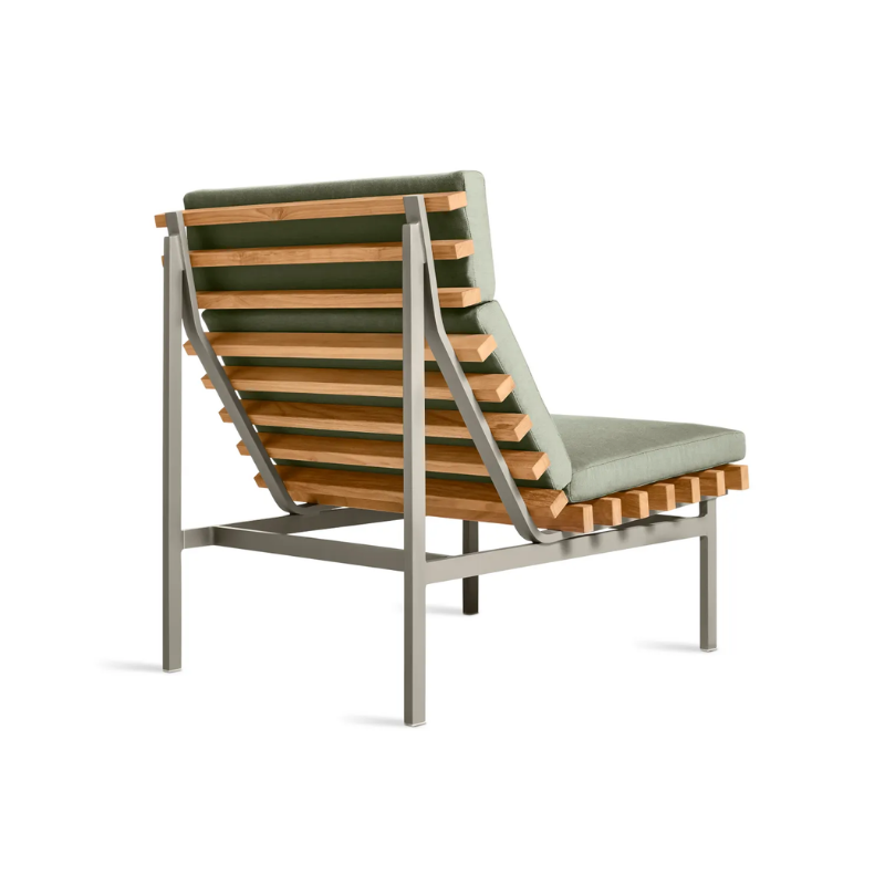 The Perch Outdoor Lounge Chair from Blu Dot with carbon frame and sunbrella oasis upholstery from the back at an angle.