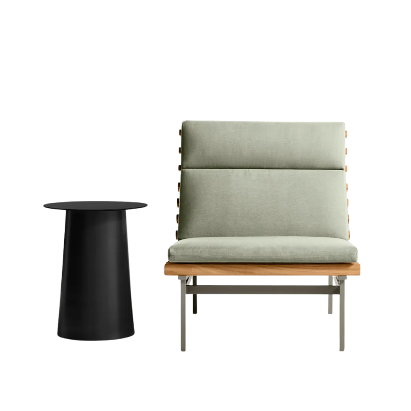 The Perch Outdoor Lounge Chair from Blu Dot with carbon frame and sunbrella oasis upholstery with a circula side table.