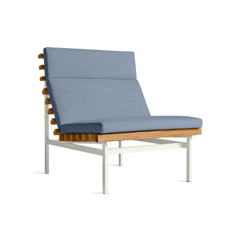 The Perch Outdoor Lounge Chair from Blu Dot with white frame and sunbrella haze upholstery from an angle.