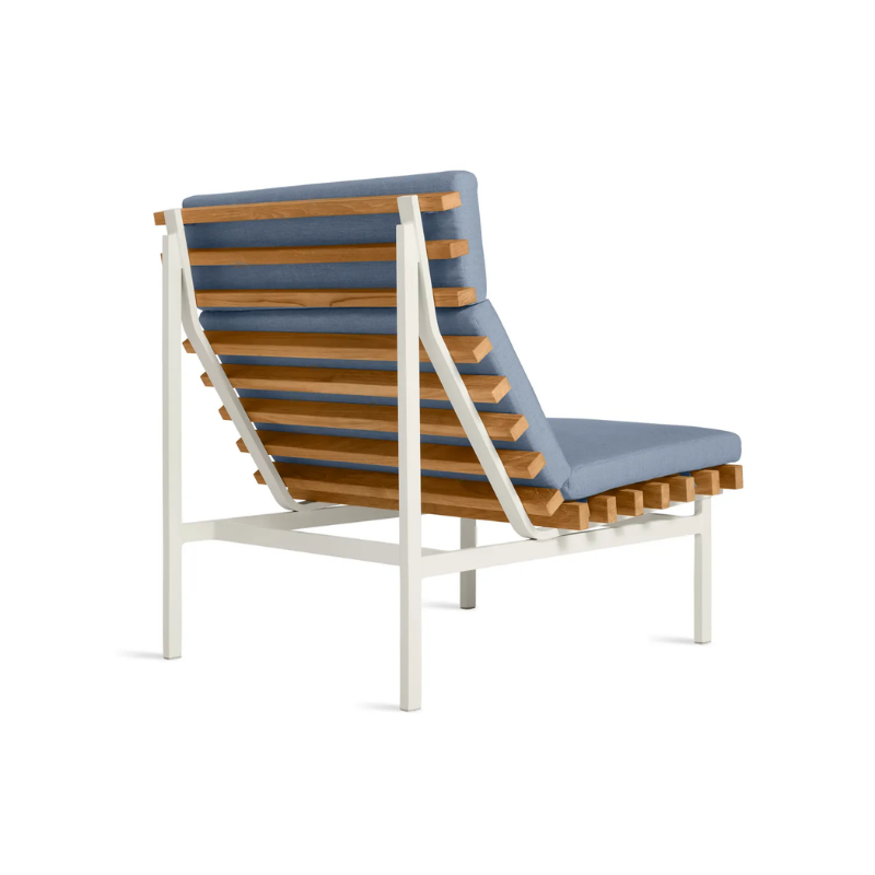 The Perch Outdoor Lounge Chair from Blu Dot with white frame and sunbrella haze upholstery from the back at an angle.