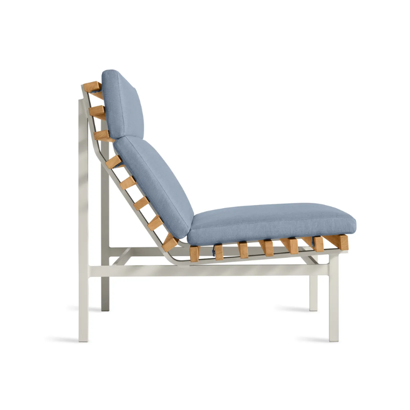 The Perch Outdoor Lounge Chair from Blu Dot with white frame and sunbrella haze upholstery from the side.
