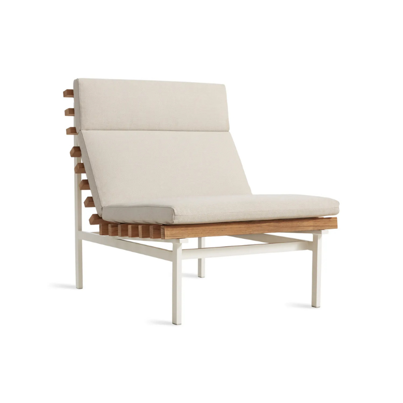 The Perch Outdoor Lounge Chair from Blu Dot with white frame and sunbrella linen upholstery from an angle.