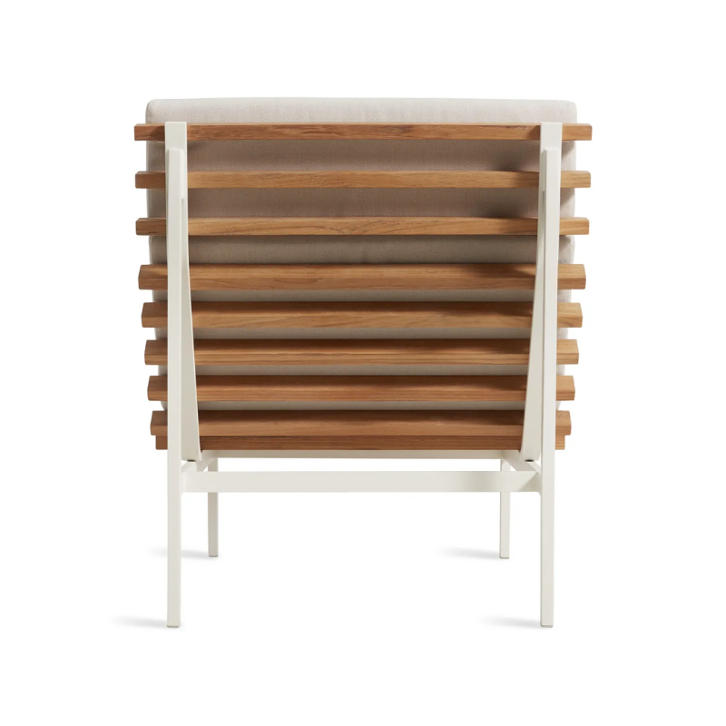 The Perch Outdoor Lounge Chair from Blu Dot with white frame and sunbrella linen upholstery from the back.