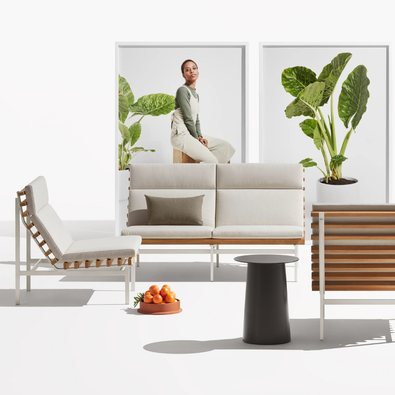 The Perch Outdoor Lounge Chair from Blu Dot with white frame and sunbrella linen upholstery in a family room.