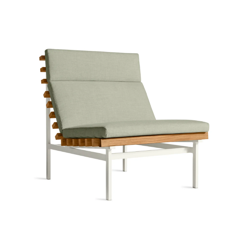 The Perch Outdoor Lounge Chair from Blu Dot with white frame and sunbrella oasis upholstery from an angle.