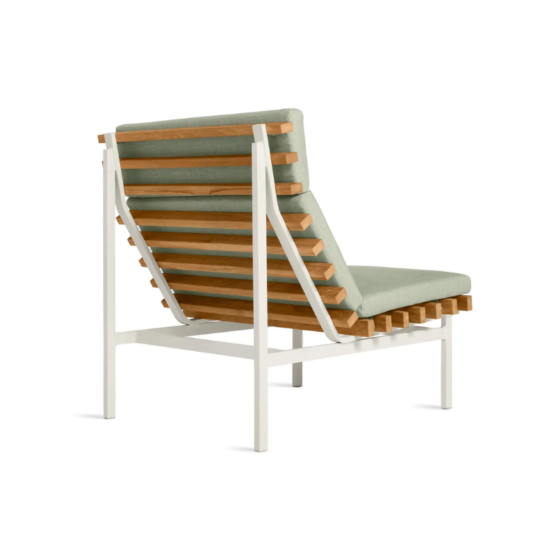 The Perch Outdoor Lounge Chair from Blu Dot with white frame and sunbrella oasis upholstery from the back at an angle.