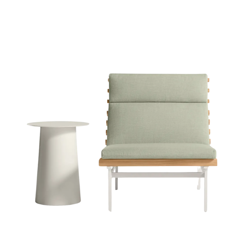 The Perch Outdoor Lounge Chair from Blu Dot with white frame and sunbrella oasis upholstery with a circula side table.