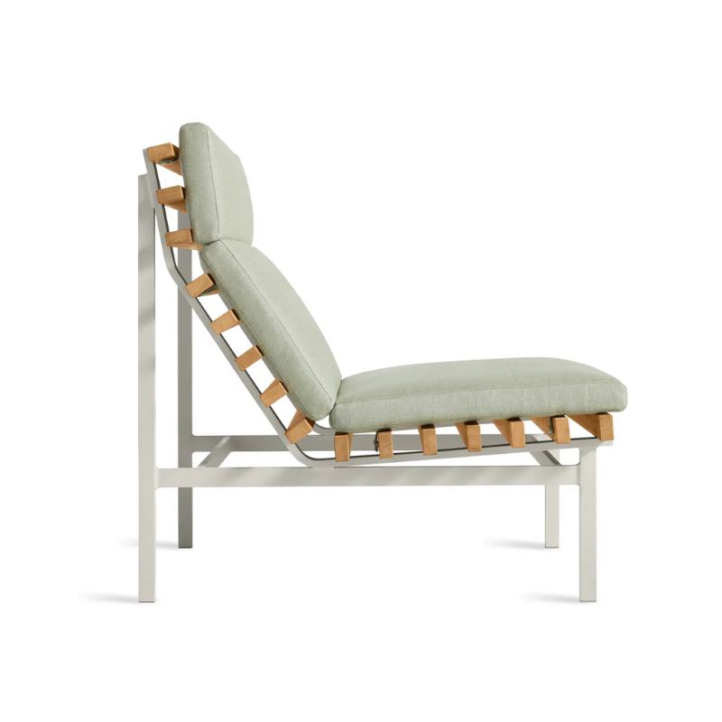 The Perch Outdoor Lounge Chair from Blu Dot with white frame and sunbrella oasis upholstery from the side.