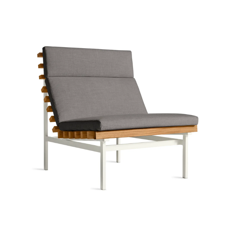 The Perch Outdoor Lounge Chair from Blu Dot with white frame and toohey charcoal upholstery from an angle.