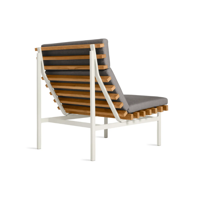 The Perch Outdoor Lounge Chair from Blu Dot with white frame and toohey charcoal upholstery from the back at an angle.