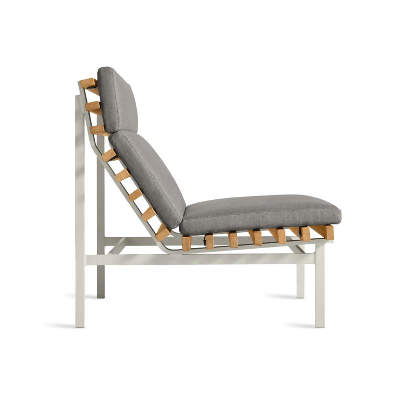 The Perch Outdoor Lounge Chair from Blu Dot with white frame and toohey charcoal upholstery from the side.