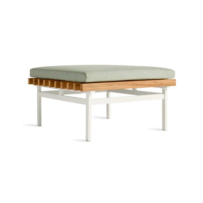 The Perch Outdoor Ottoman from String Furniture with white frame and sunbrella oasis upholstery from an angle.