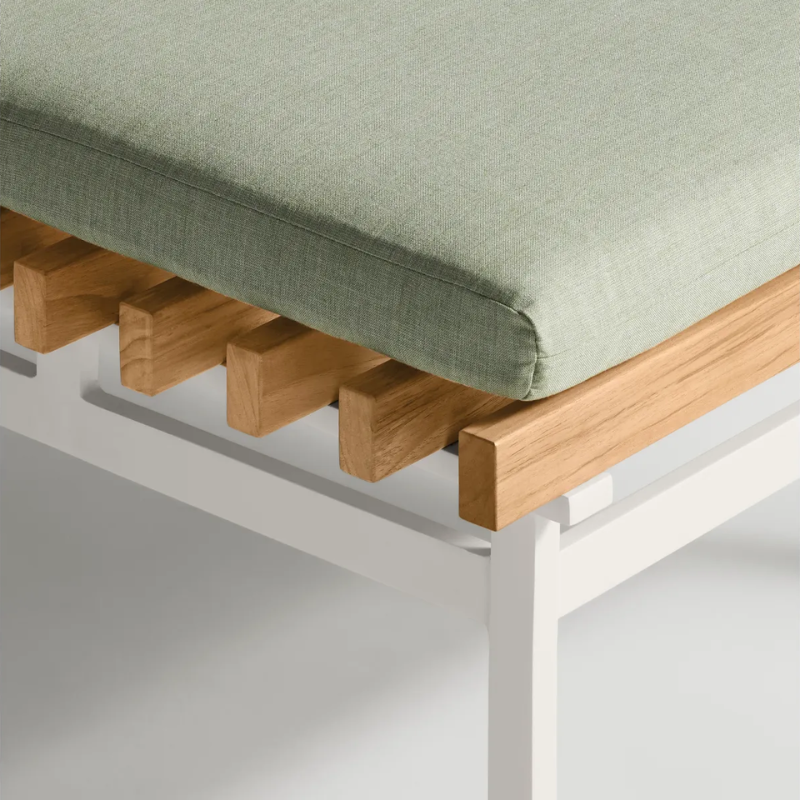 The Perch Outdoor Ottoman from String Furniture with white frame and sunbrella oasis upholstery close up.