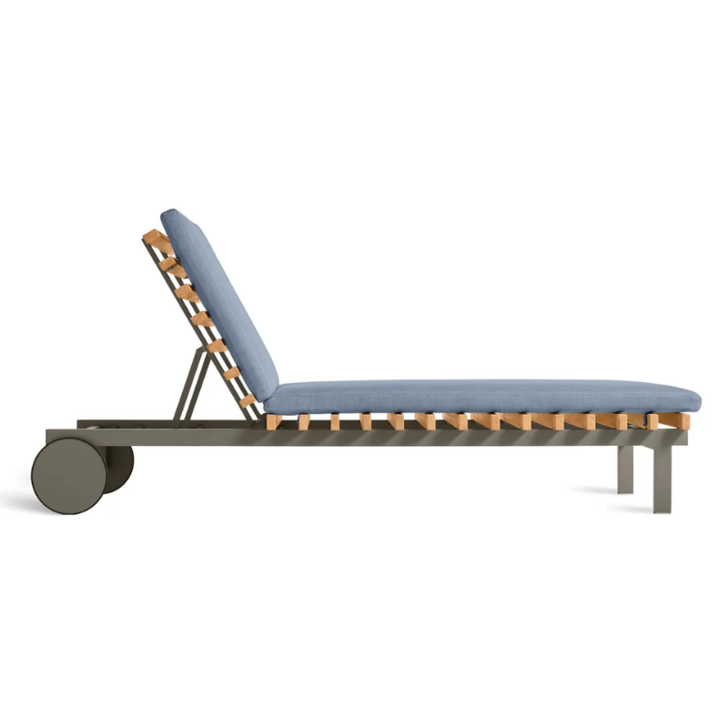 The Perch Outdoor Sun Lounger from Blu Dot with the carbon frame and sunbrella haze upholstery from the side.