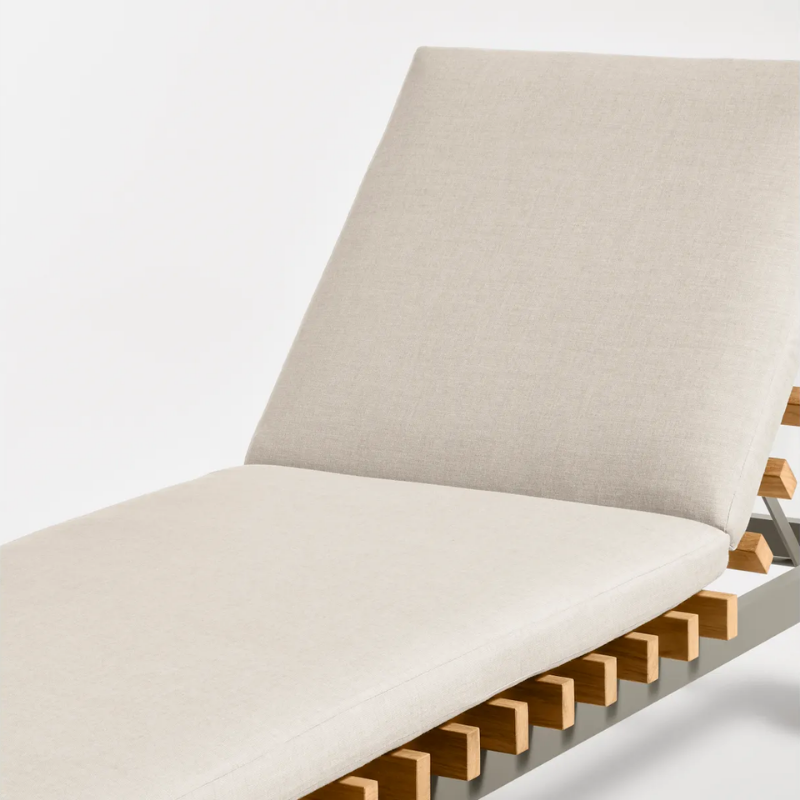 The Perch Outdoor Sun Lounger from Blu Dot with the carbon frame and sunbrella linen upholstery close up.