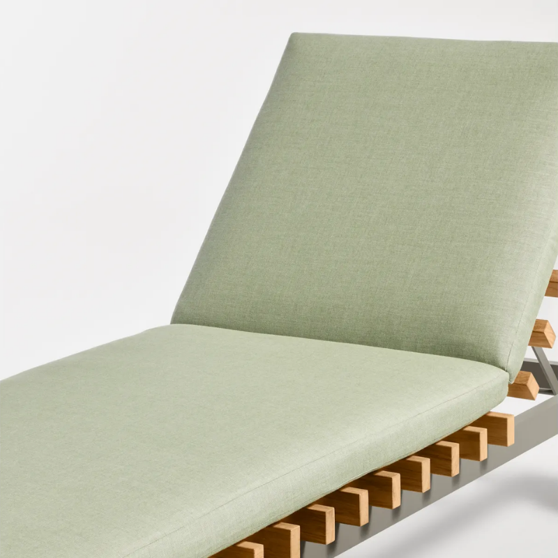 The Perch Outdoor Sun Lounger from Blu Dot with the carbon frame and sunbrella oasis upholstery close up.