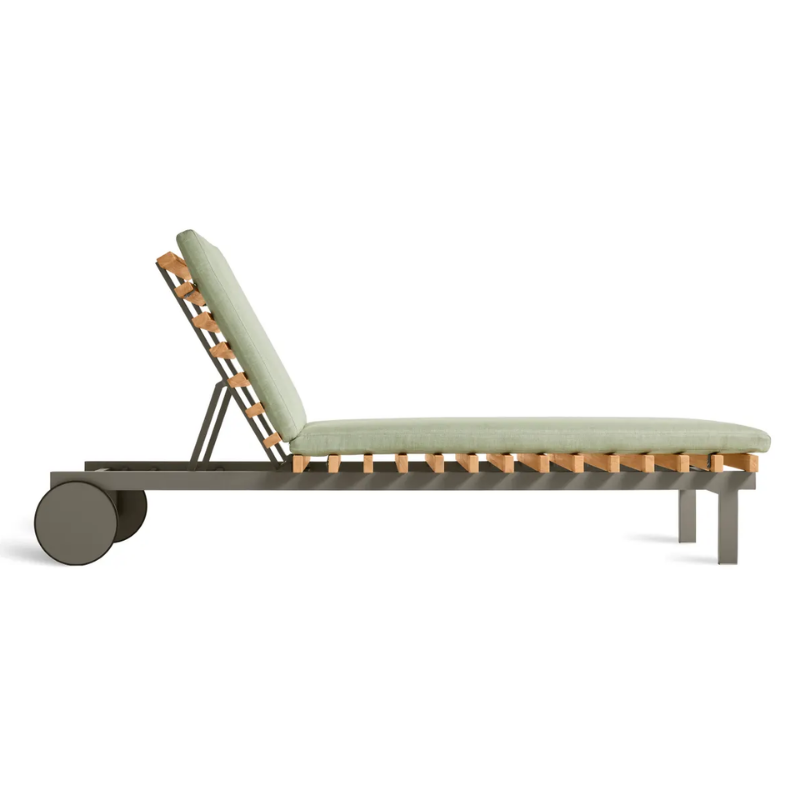 The Perch Outdoor Sun Lounger from Blu Dot with the carbon frame and sunbrella oasis upholstery from the side.