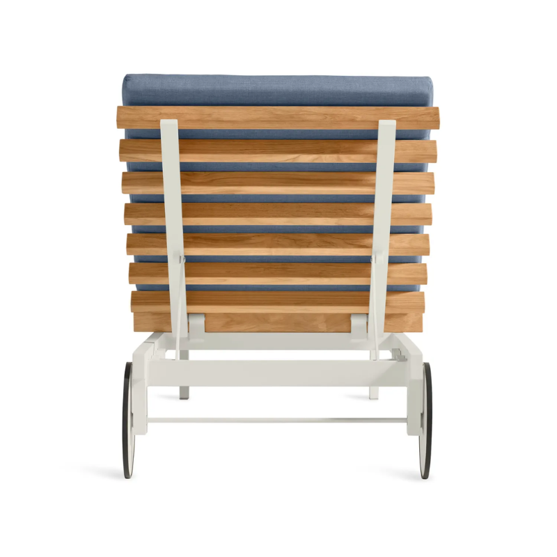 The Perch Outdoor Sun Lounger from Blu Dot with the white frame and sunbrella haze upholstery from the back.