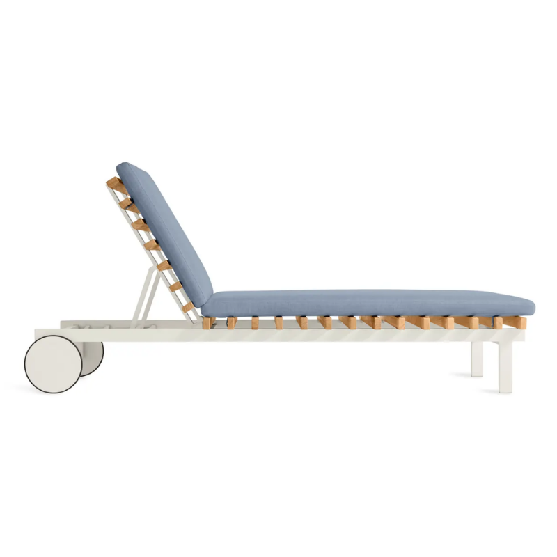 The Perch Outdoor Sun Lounger from Blu Dot with the white frame and sunbrella haze upholstery from the side.