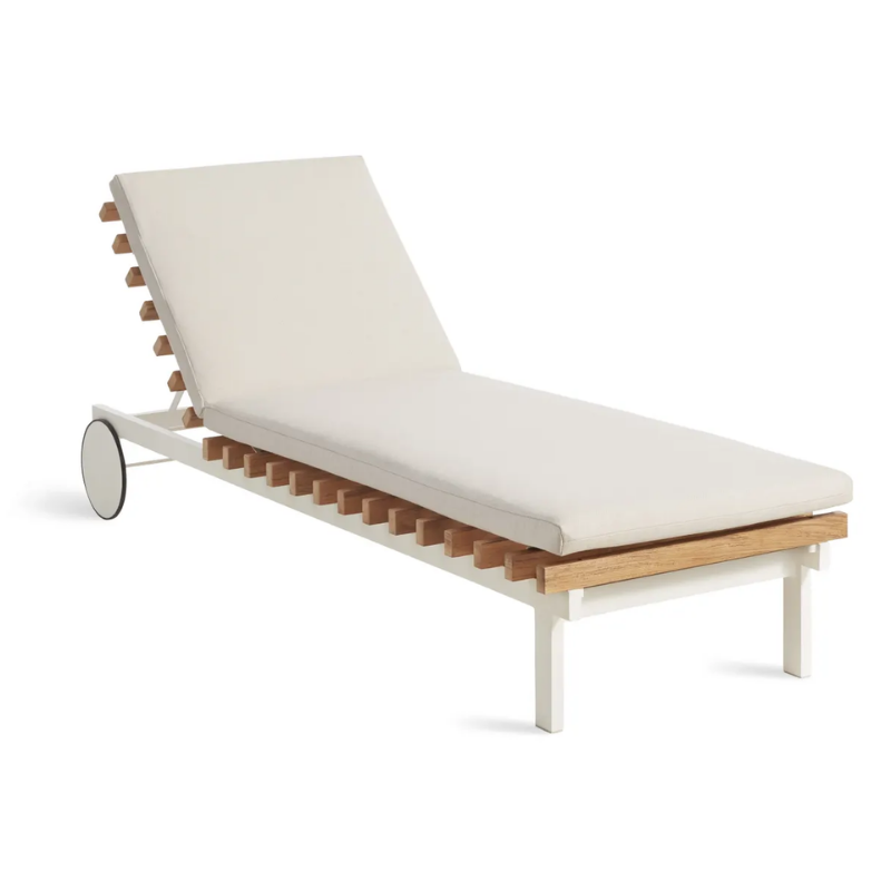 The Perch Outdoor Sun Lounger from Blu Dot with the white frame and sunbrella linen upholstery from an angle.