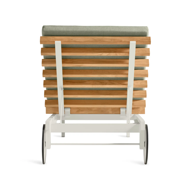 The Perch Outdoor Sun Lounger from Blu Dot with the white frame and sunbrella oasis upholstery from the back.