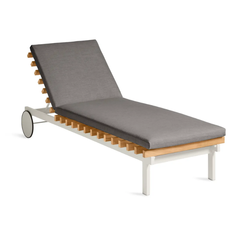 The Perch Outdoor Sun Lounger from Blu Dot with the white frame and toohey charcoal upholstery from an angle.
