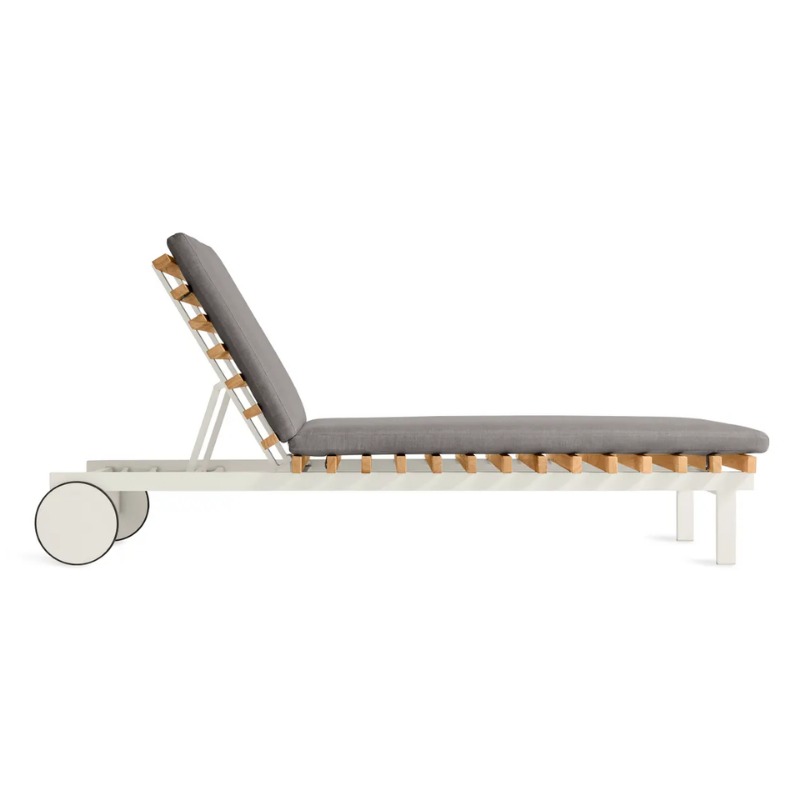The Perch Outdoor Sun Lounger from Blu Dot with the white frame and toohey charcoal upholstery from the side.