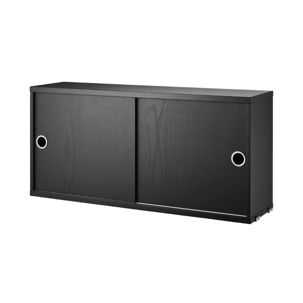 The Cabinet with Sliding Doors from String Furniture in the 7.8 inch depth size and black stained ash color.