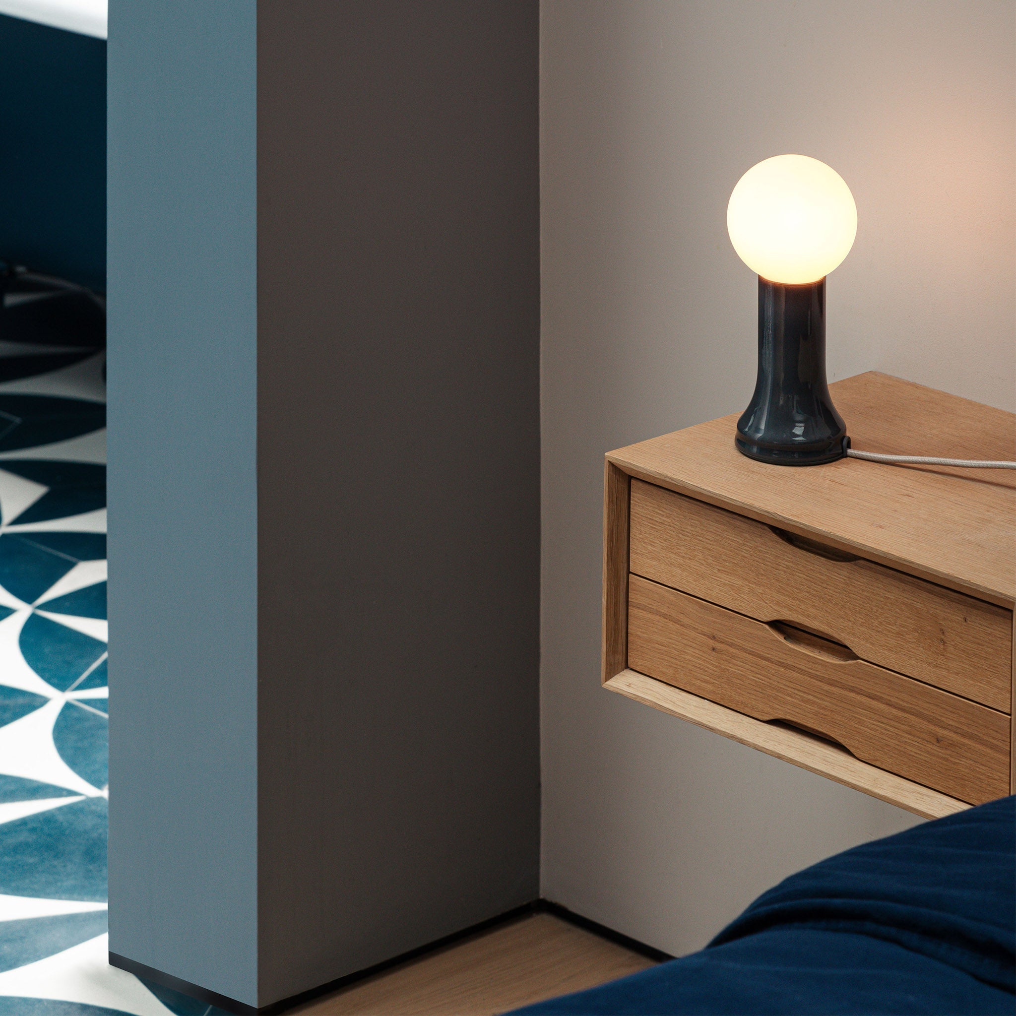 The Shore Table lamp from Tala Lighting in Brown on a bedside table.