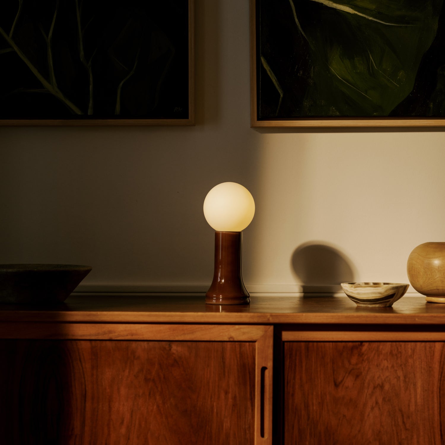 The Shore Table lamp from Tala Lighting in Brown on a sideboard.
