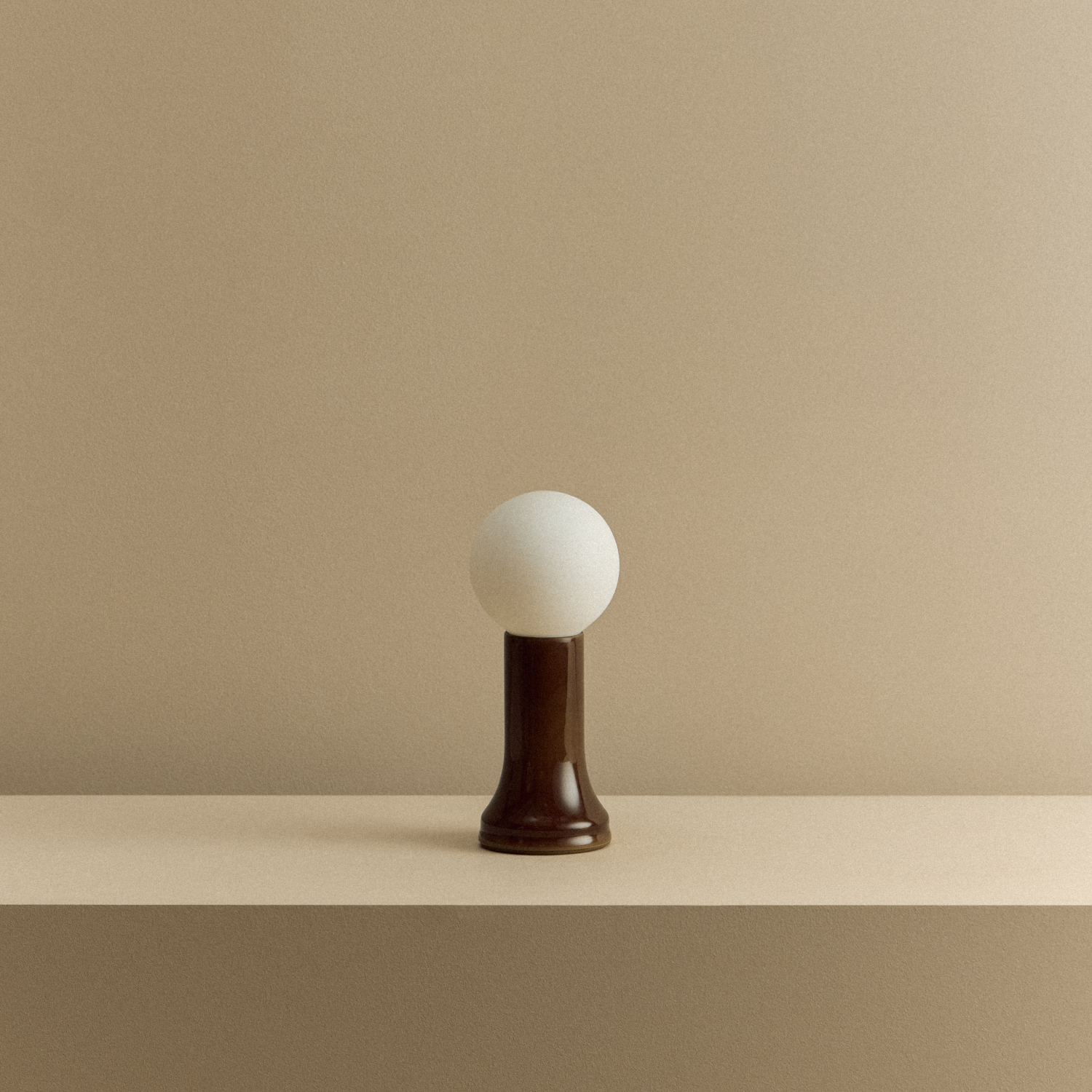 The Shore Table lamp from Tala Lighting in Brown turned off.