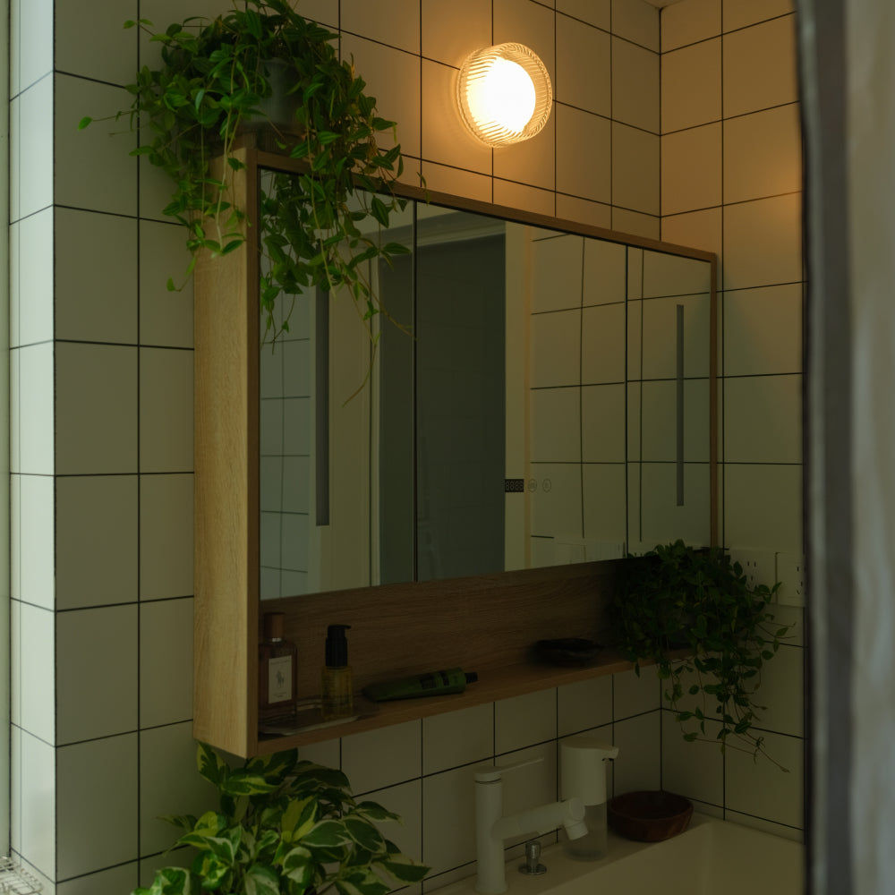 The Firth Wall Light by Tala Lighting in a bathroom