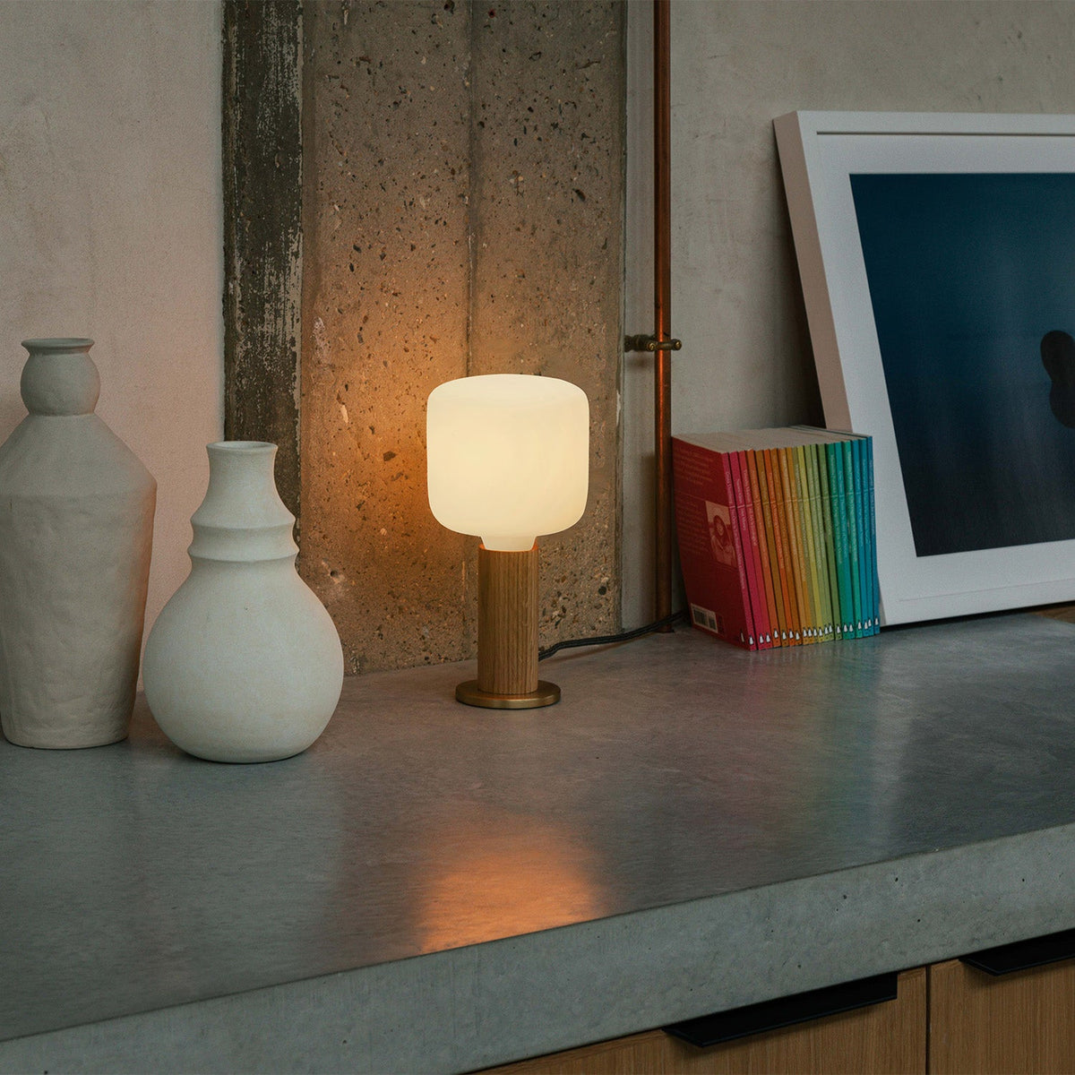 The Oblo E26 LED Bulb by Tala Lighting in a knuckle table lamp.