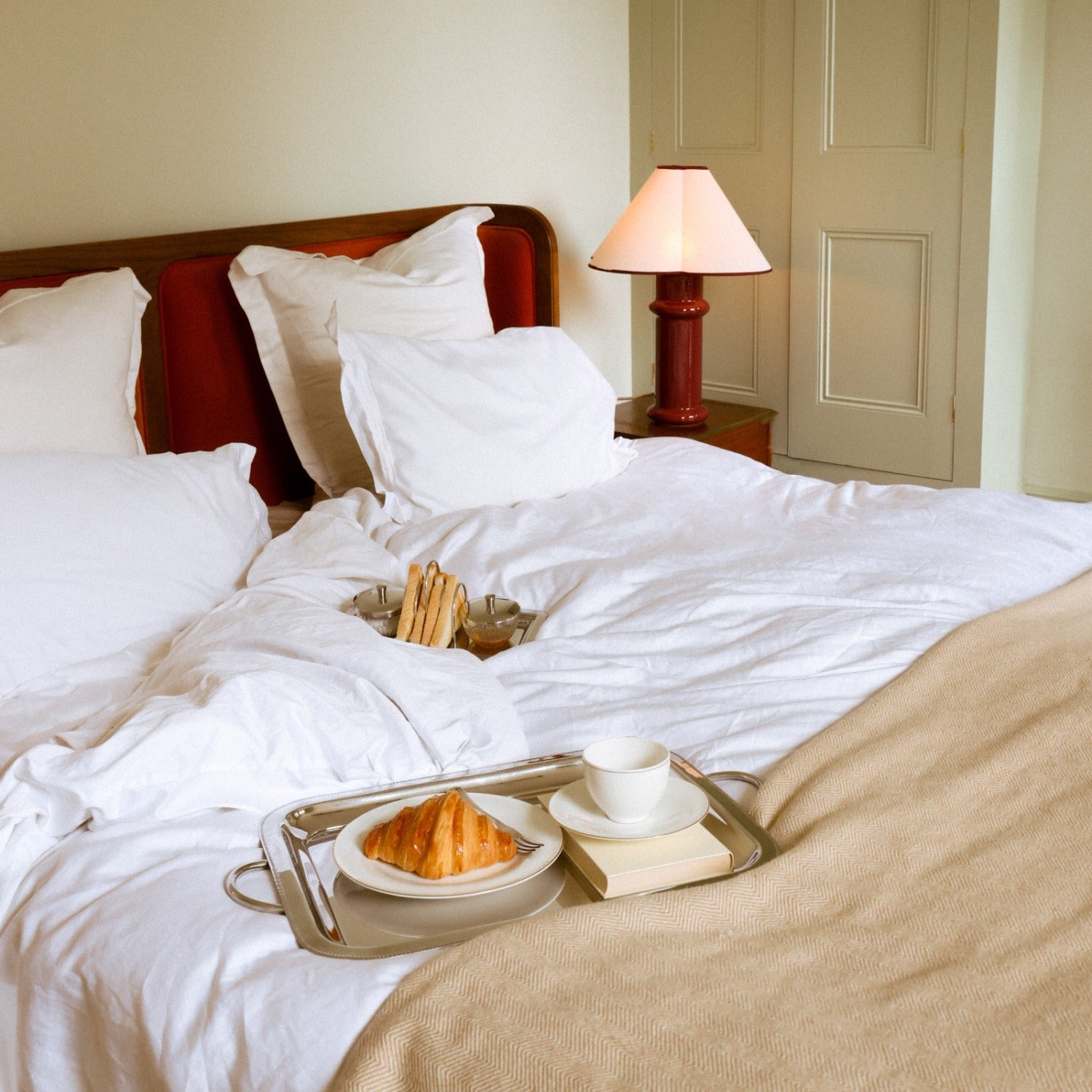 the Heath Table Lamp by Tala Lighting in Port Red in a bedroom.