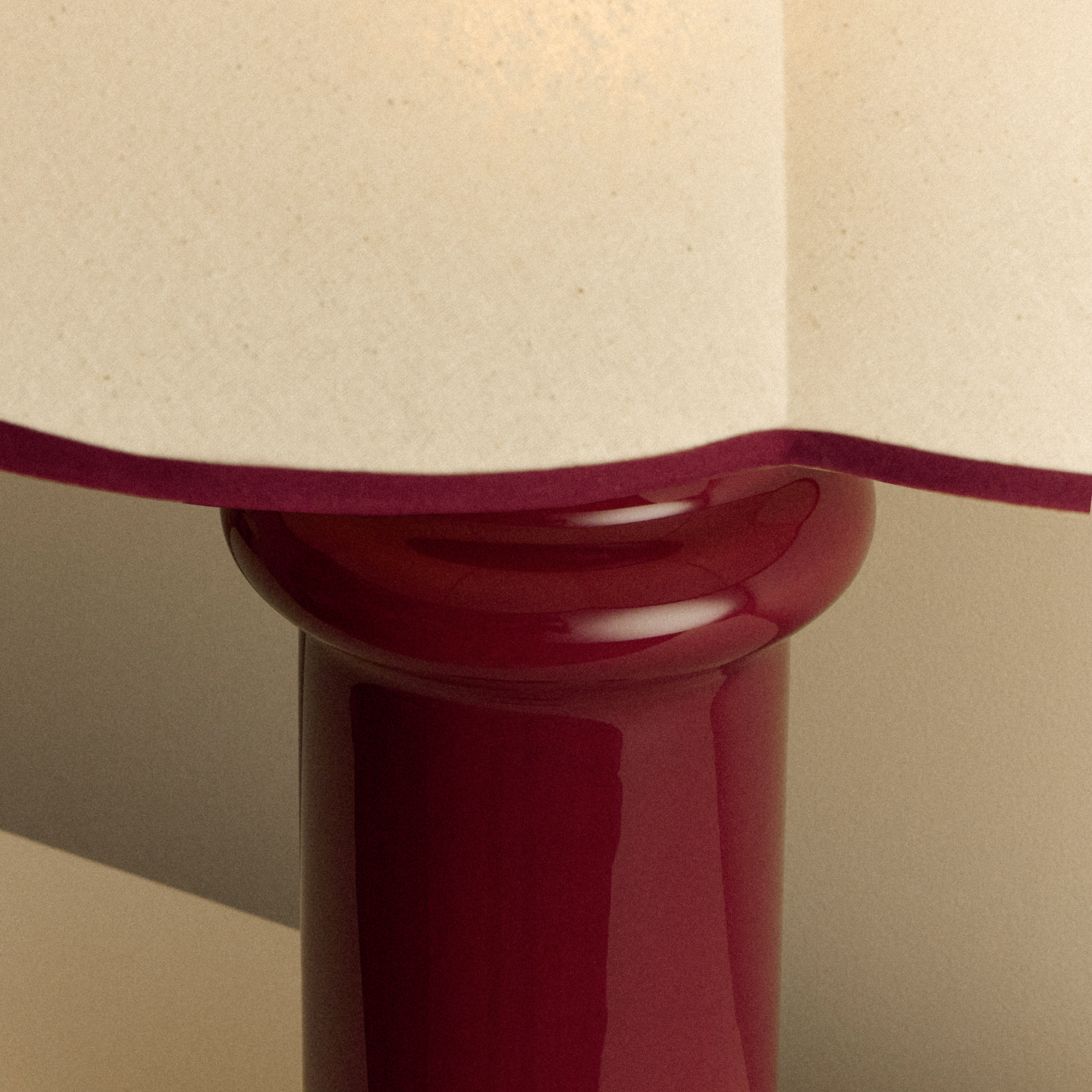 Close up of the Heath Table Lamp by Tala Lighting in Port Red.