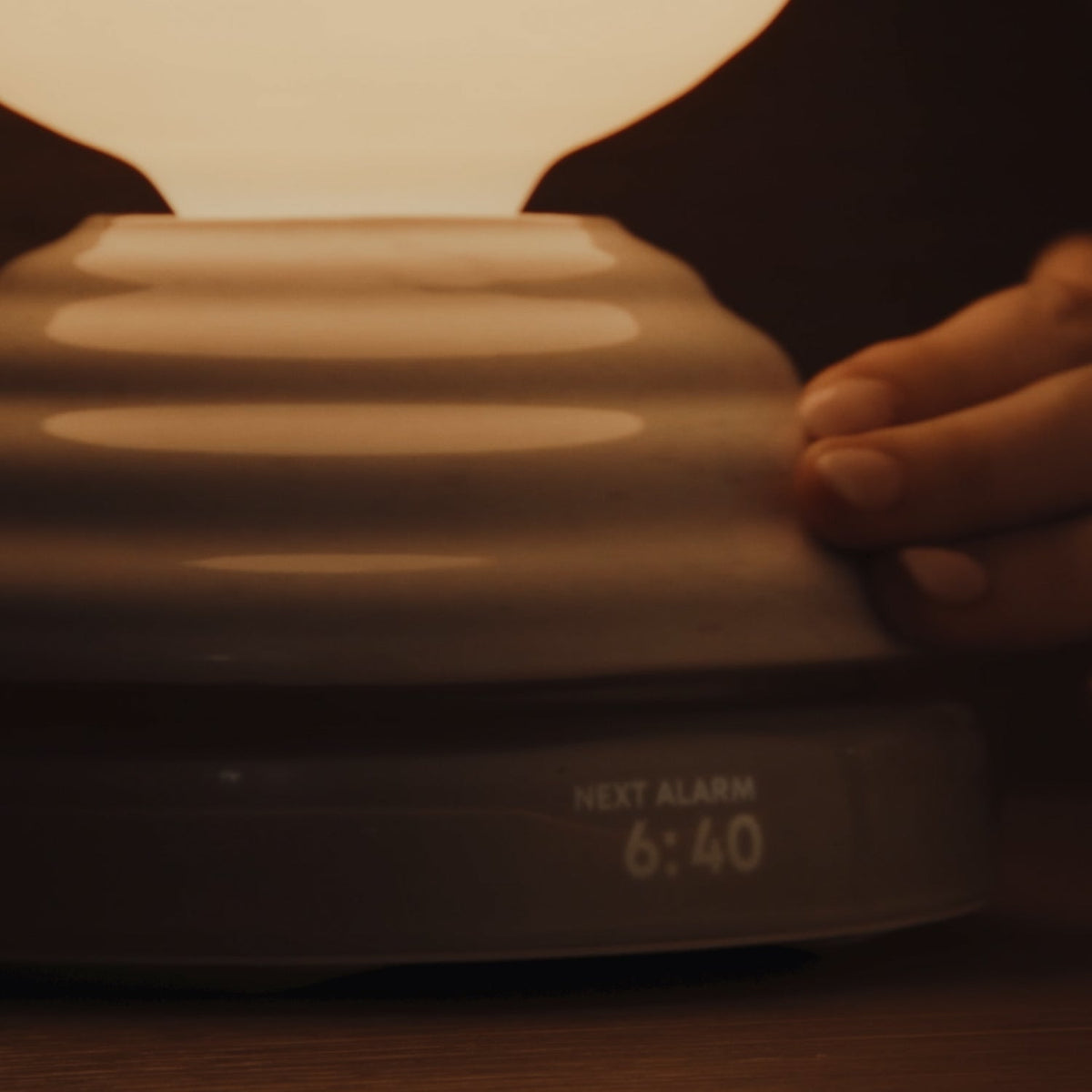 The Wake Sleep Light by Tala Lighting alarm clock base.