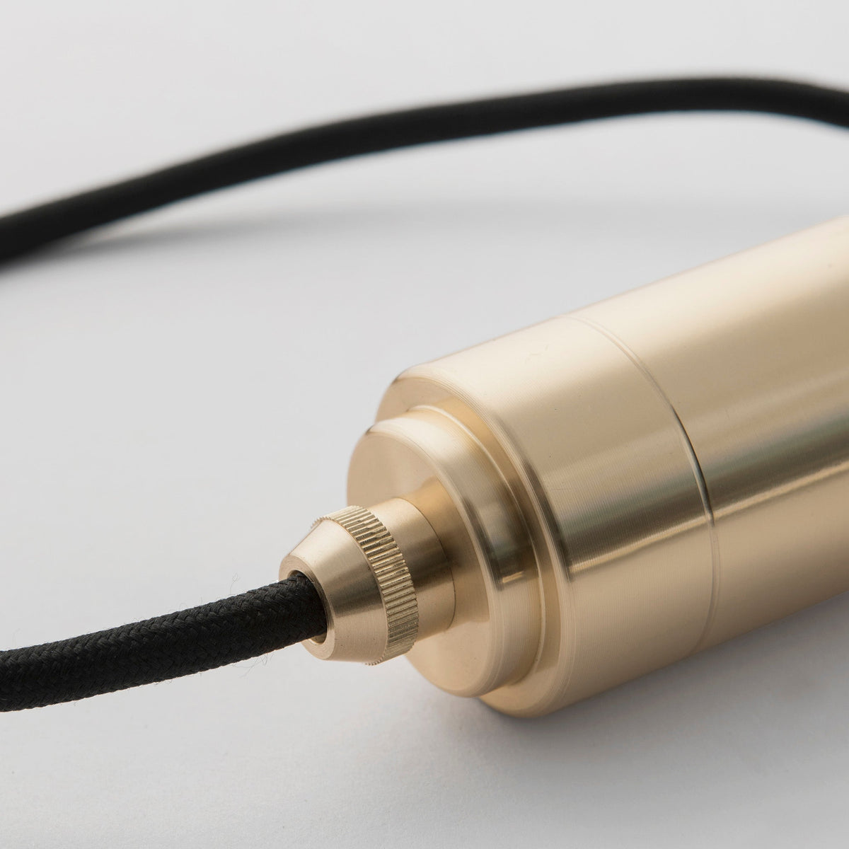 The brass detailing of the Triple Pendant in Brass + Sphere IV by Tala US. all-groups