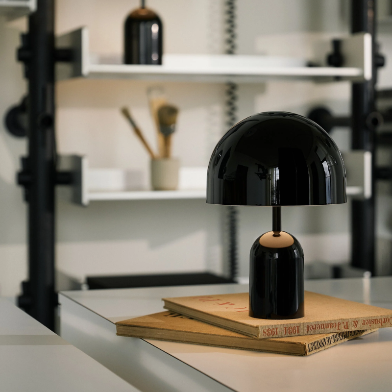 The Bell Portable LED from Tom Dixon in black in a home office.