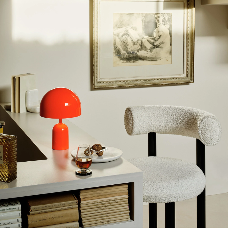 The Bell Portable LED from Tom Dixon in fluro in a kitchen and dining area.