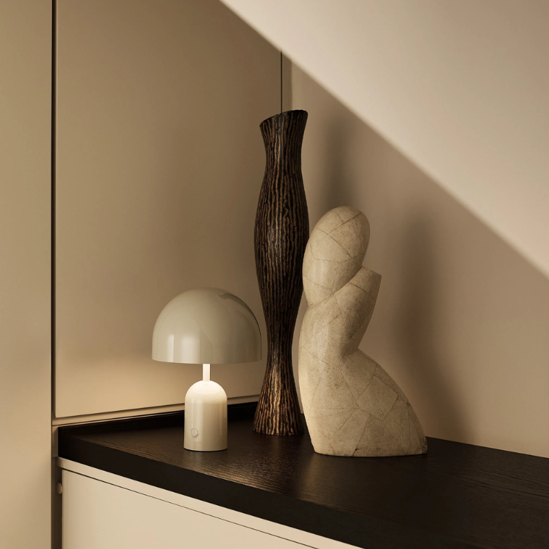 The Bell Portable LED from Tom Dixon in putty with decor.