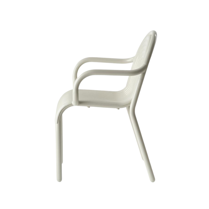 Profile view of the Groove Arm Dining Chair in Putty by Tom Dixon.