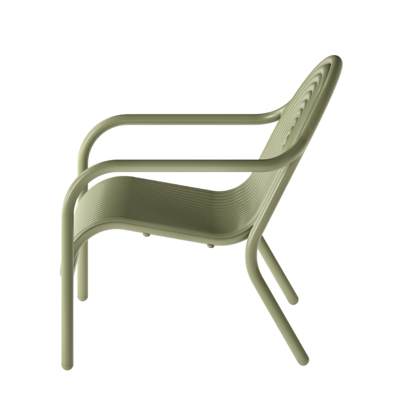 Profile view of the Groove Outdoor Lounge Chair by Tom Dixon in Moss.
