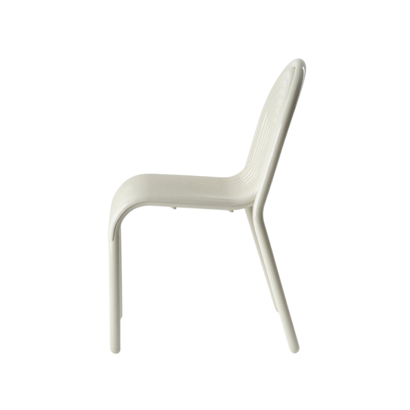 Profile view of the Groove Arm Dining Chair in Putty by Tom Dixon.
