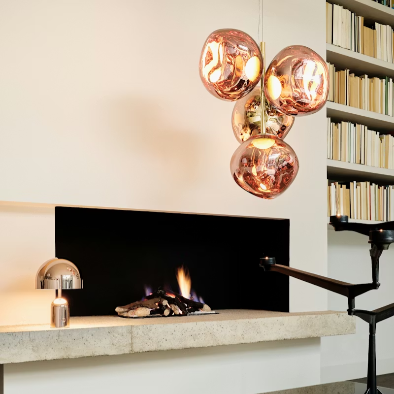 Tom Dixon Melt Chandelier Mini in Copper by a fireplace. all-groups