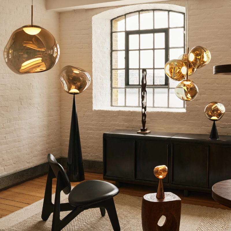 The Melt Collection from Tom Dixon in Bronze shown in a residence.