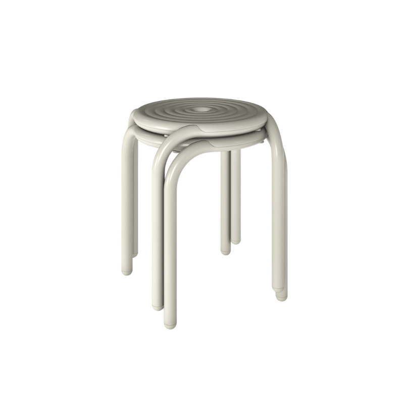 Two stacked Groove Outdoor Stools in Putty by Tom Dixon.