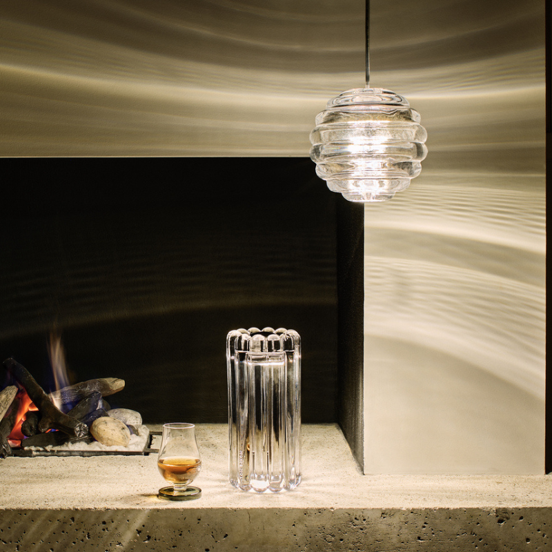 Tom Dixon Press Sphere Pendants in a living room.